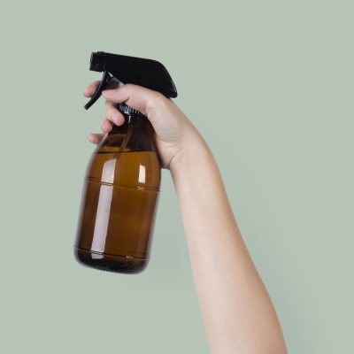 water spray mist held by raised hand -