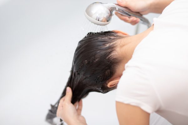 beauty hygiene girl washes her hair with shampoo home bathroom -