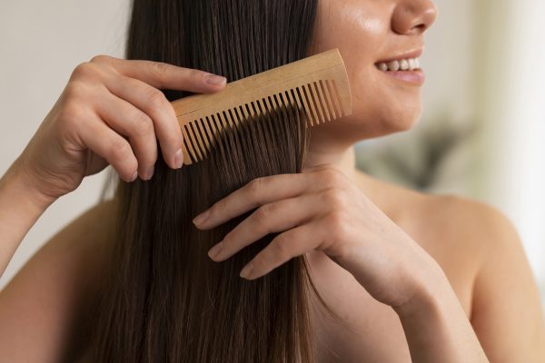 side view woman hair slugging night routine -