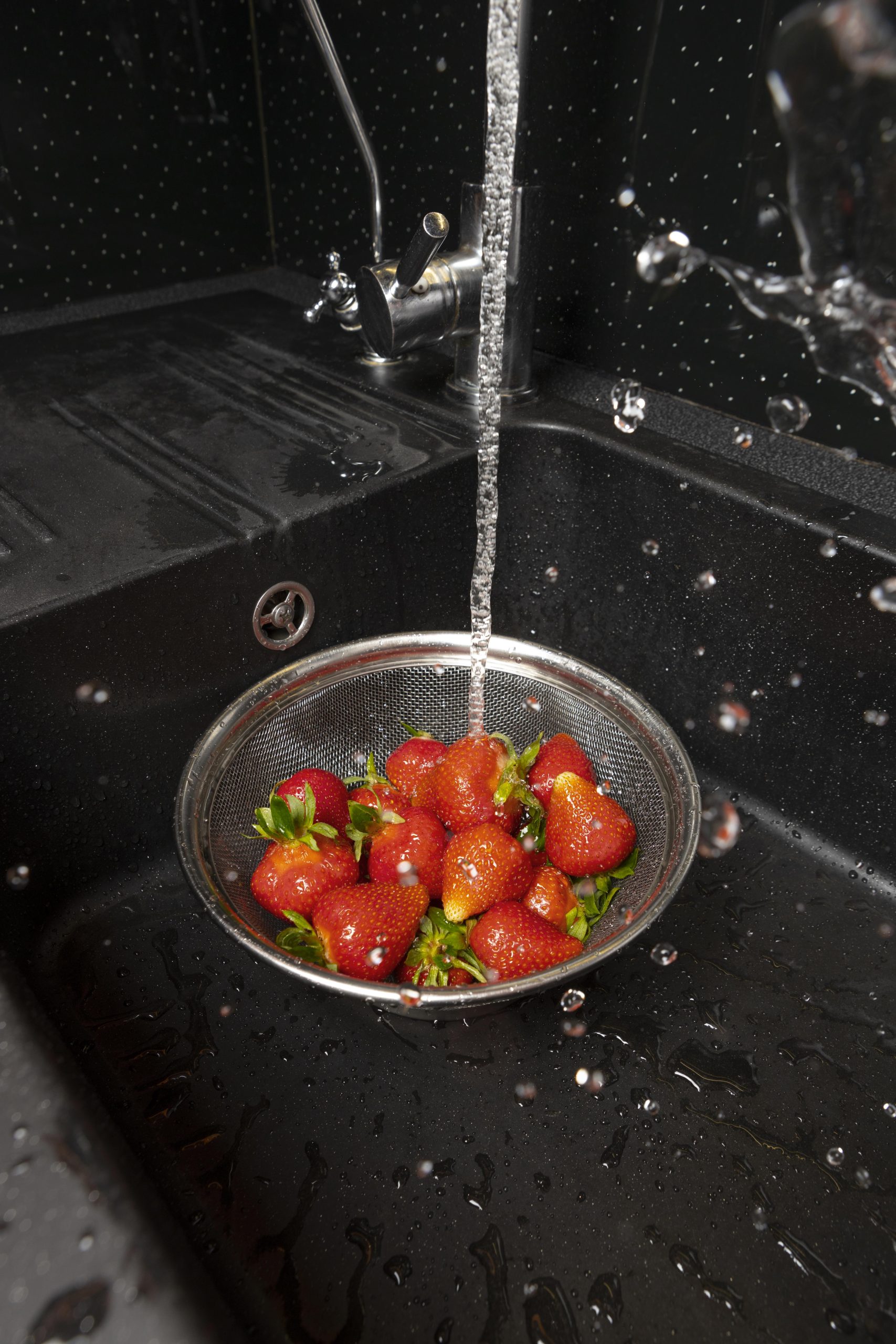 assortment strawberries being washed scaled -