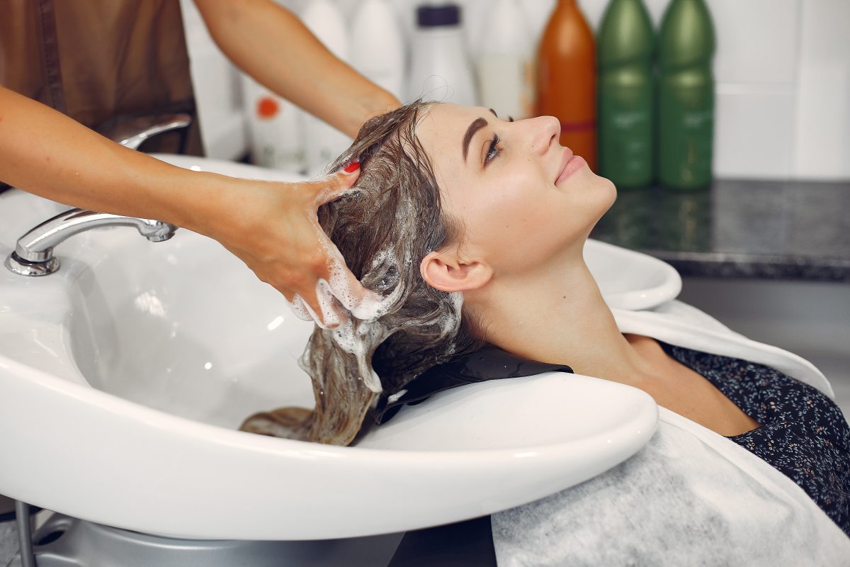 woman washing head hairsalon -
