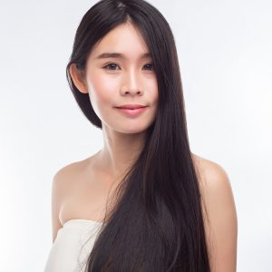 woman wore white strapless dress smiled happily -