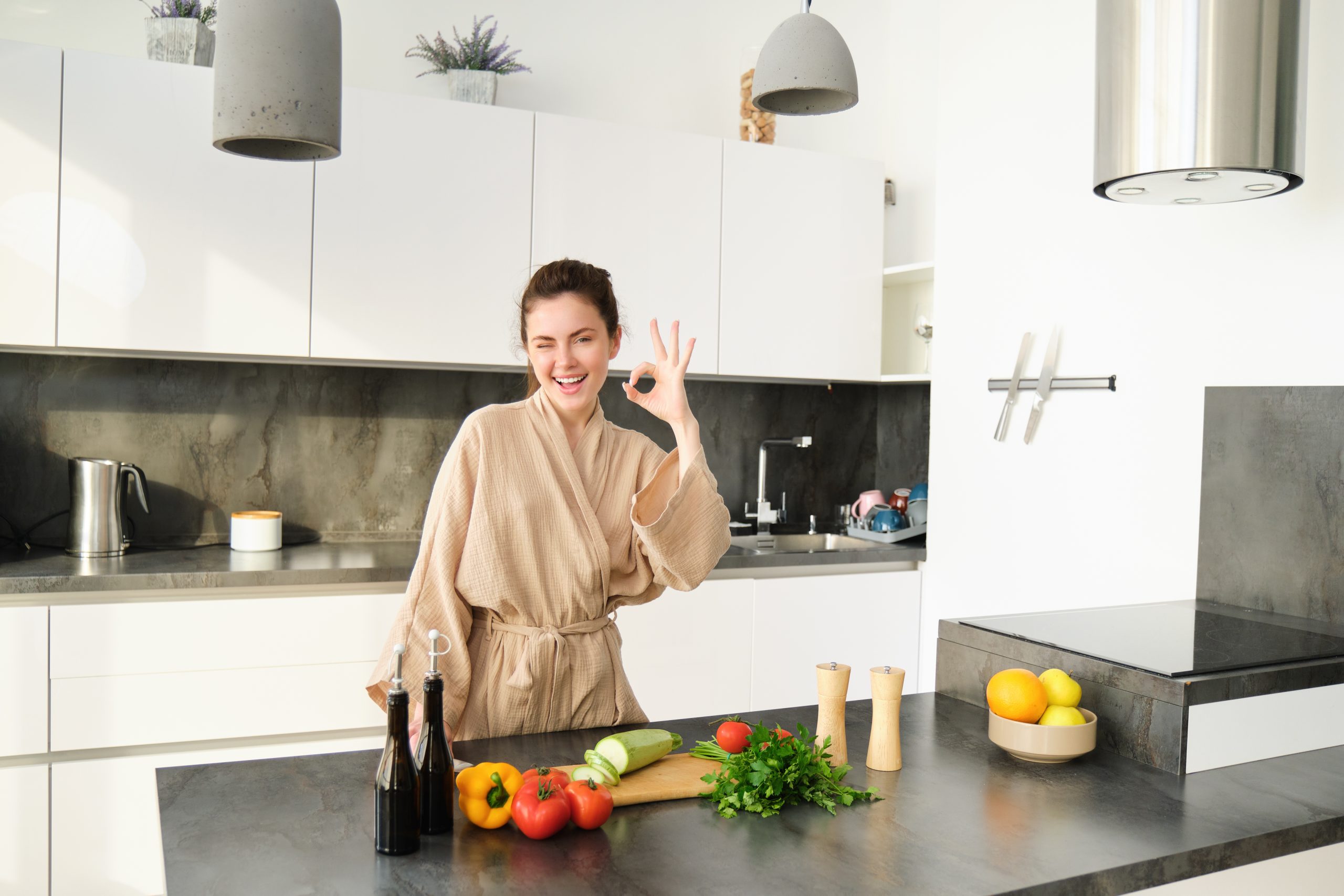 portrait beautiful young woman her home clothes chopping vegetables holding knife cutting scaled -